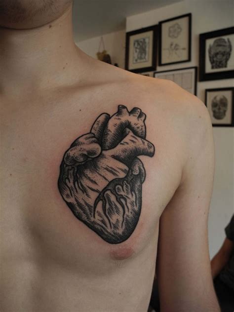 Black Anatomical Heart Tattoo On The Chest Tattoogrid Net