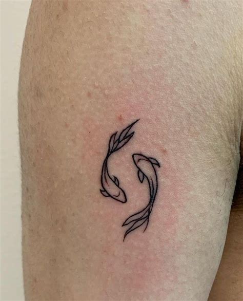 Pisces Inspired Tattoo On The Back Of The Left Arm Artofit Pisces Inspired Tattoo On The Back Of The Left Arm Artofit