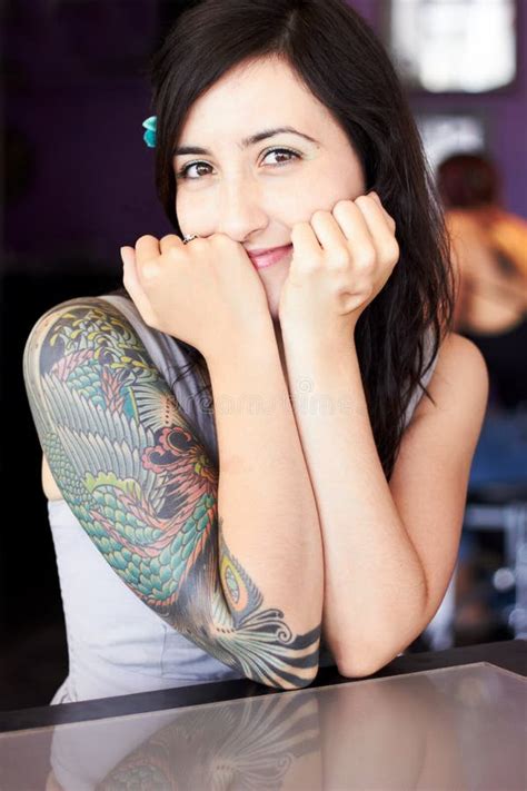 Showcasing Her Individual Style Portrait Of A Female Tattoo Artist